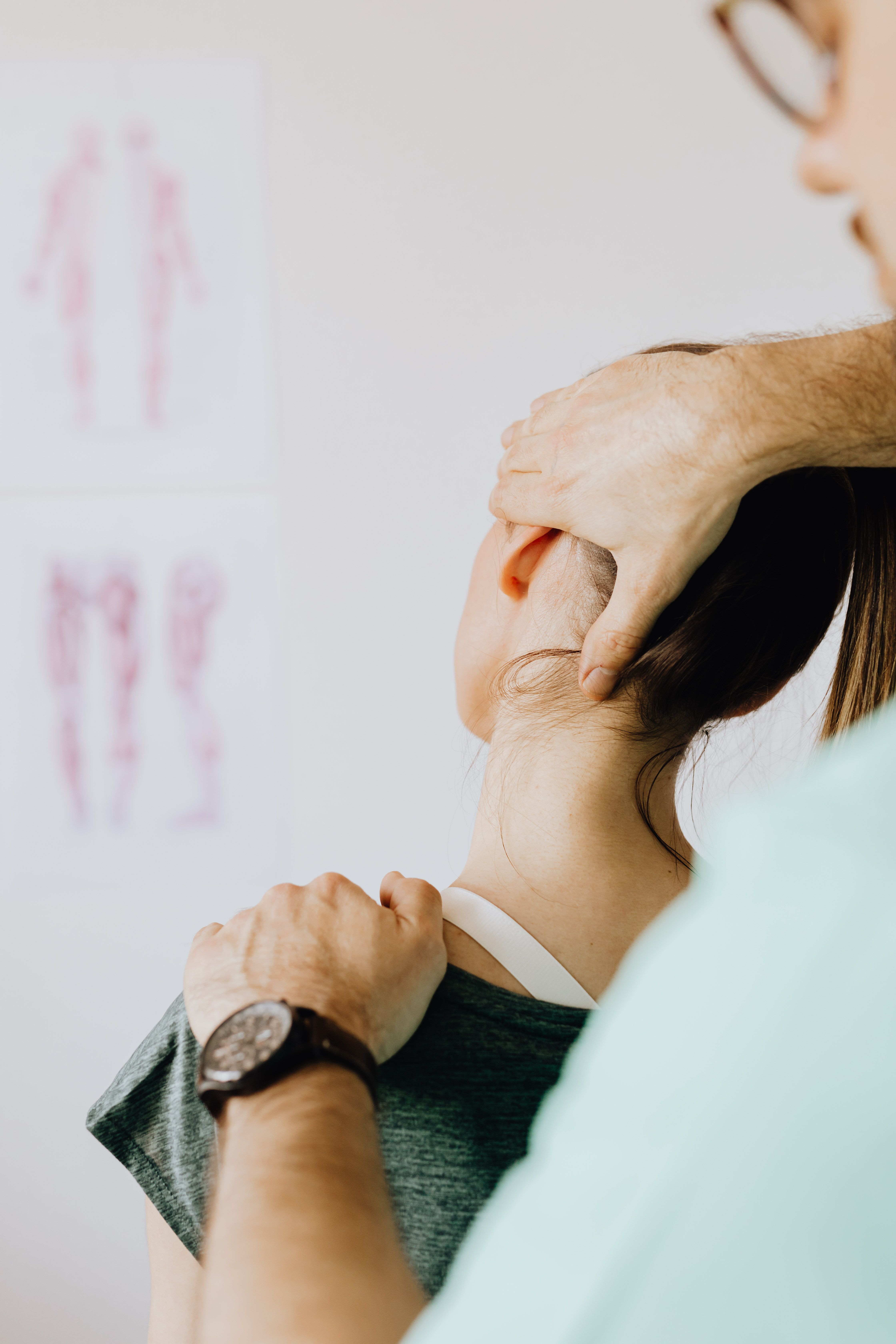 Chiropractor providing gentle, hands-on neck care to a patient
