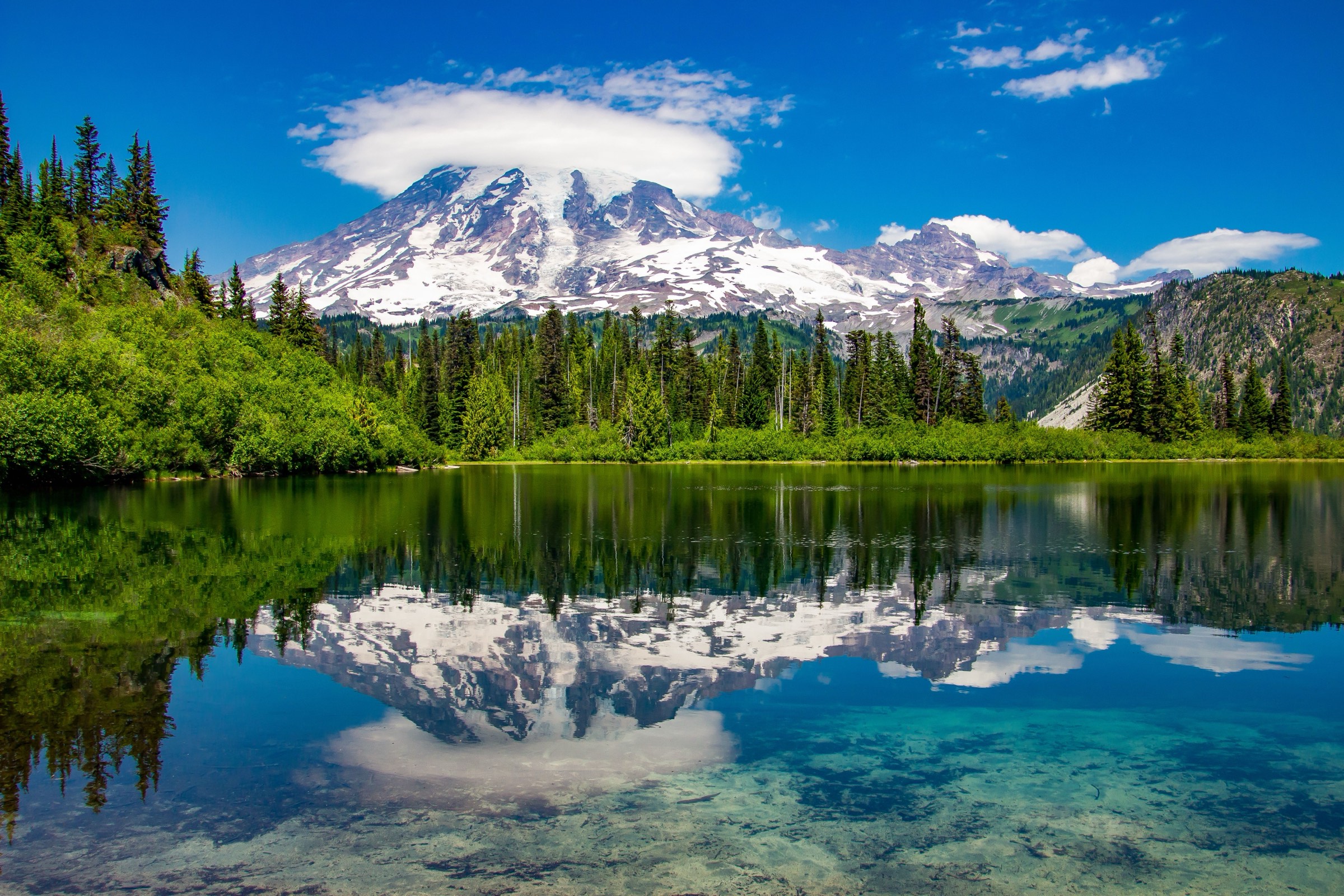 Mount Rainier reflected in a clear alpine lake near Gig Harbor